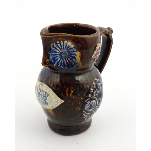 158 - A Victorian Measham bargeware novelty jug formed as an owl bearing plaque titled Good Old Owl. Appro... 