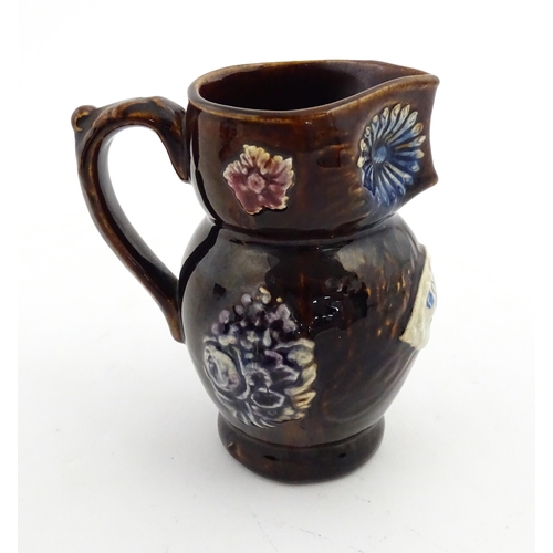 158 - A Victorian Measham bargeware novelty jug formed as an owl bearing plaque titled Good Old Owl. Appro... 