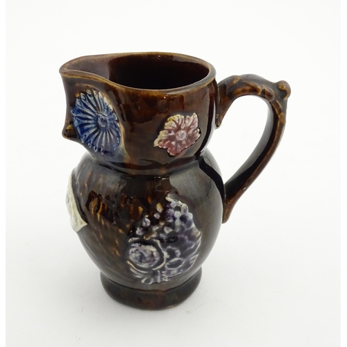 158 - A Victorian Measham bargeware novelty jug formed as an owl bearing plaque titled Good Old Owl. Appro... 