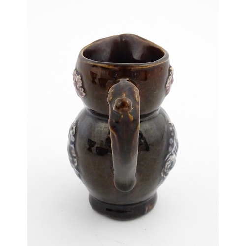 158 - A Victorian Measham bargeware novelty jug formed as an owl bearing plaque titled Good Old Owl. Appro... 