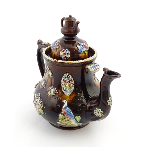 165 - A Measham bargeware commemorative teapot with teapot finial to lid, decorated with birds, flowers, f... 