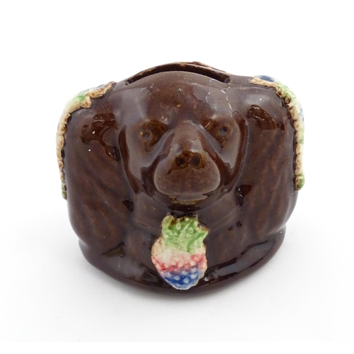 170 - A Victorian Measham bargeware novelty money box formed as the head of a Spaniel dog. Approx. 3 1/2