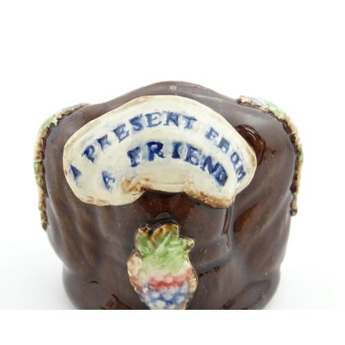 170 - A Victorian Measham bargeware novelty money box formed as the head of a Spaniel dog. Approx. 3 1/2