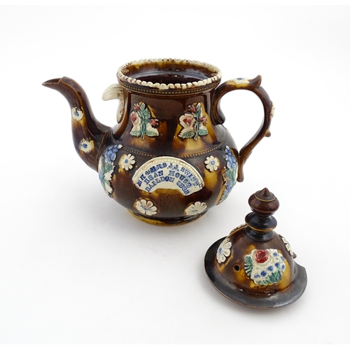 171 - A Victorian Measham bargeware teapot decorated with flowers and foliage, bearing plaque titled Mr & ... 