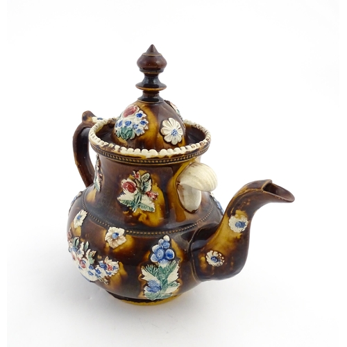 171 - A Victorian Measham bargeware teapot decorated with flowers and foliage, bearing plaque titled Mr & ... 