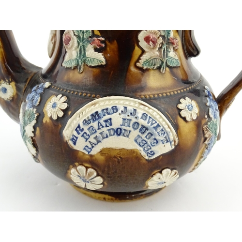 171 - A Victorian Measham bargeware teapot decorated with flowers and foliage, bearing plaque titled Mr & ... 