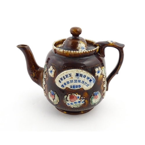 175 - A Victorian Measham bargeware teapot decorated with flowers, thistles and foliage, bearing plaque ti... 