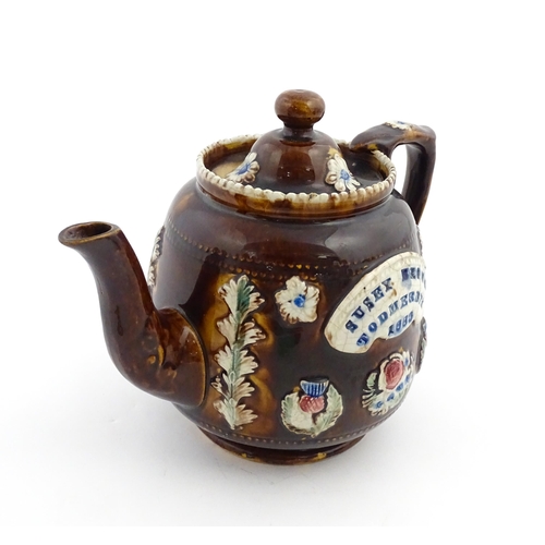 175 - A Victorian Measham bargeware teapot decorated with flowers, thistles and foliage, bearing plaque ti... 