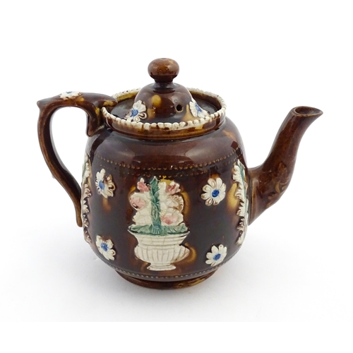 175 - A Victorian Measham bargeware teapot decorated with flowers, thistles and foliage, bearing plaque ti... 