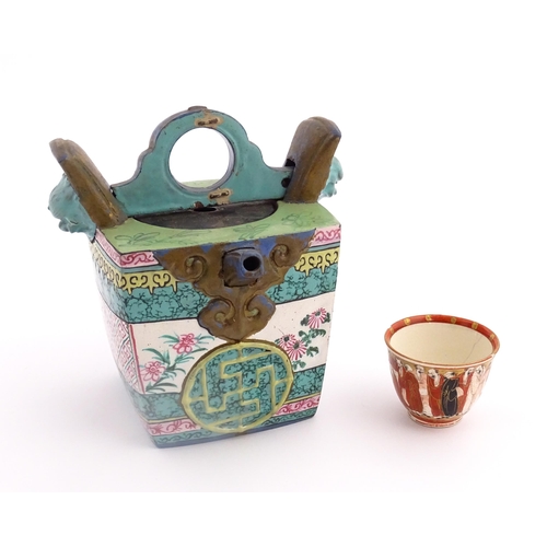 19 - An Oriental teapot of squared form with banded decoration. Together with a Japanese Kutani sake cup ... 