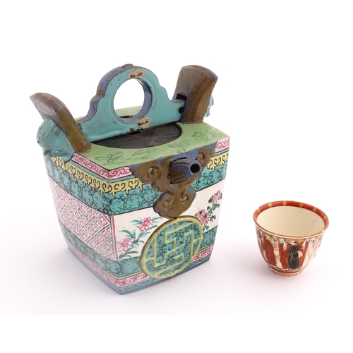 19 - An Oriental teapot of squared form with banded decoration. Together with a Japanese Kutani sake cup ... 