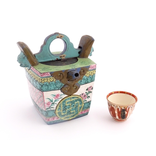 19 - An Oriental teapot of squared form with banded decoration. Together with a Japanese Kutani sake cup ... 