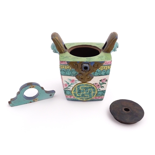 19 - An Oriental teapot of squared form with banded decoration. Together with a Japanese Kutani sake cup ... 