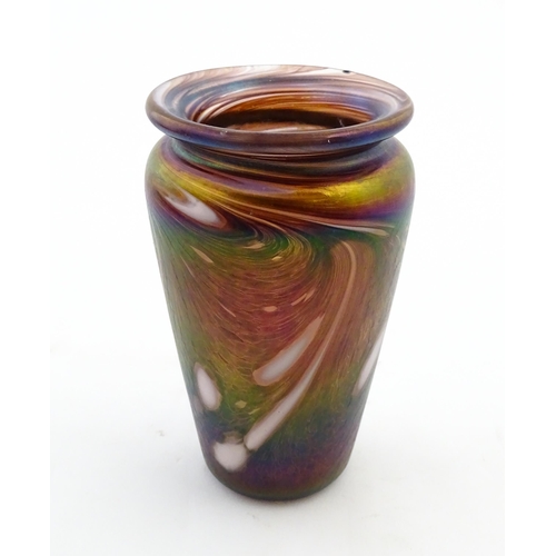 223 - An art glass vase of tapering form with iridescent detail. Approx. 5 3/4