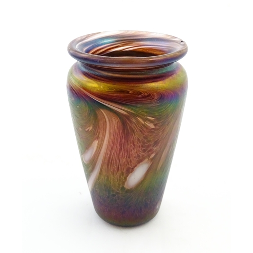 223 - An art glass vase of tapering form with iridescent detail. Approx. 5 3/4