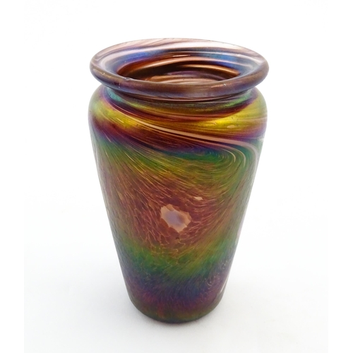 223 - An art glass vase of tapering form with iridescent detail. Approx. 5 3/4