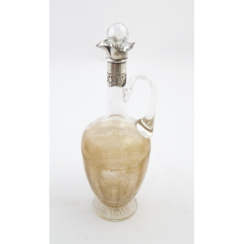 238 - A glass claret jug with silver collar hallmarked Birmingham 1927 maker William Hutton & Sons Ltd. Ap... 