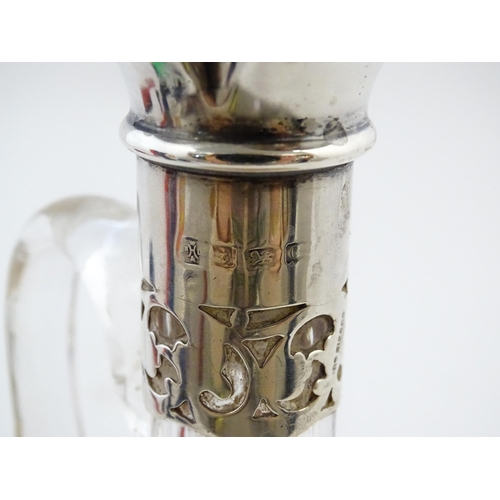 238 - A glass claret jug with silver collar hallmarked Birmingham 1927 maker William Hutton & Sons Ltd. Ap... 