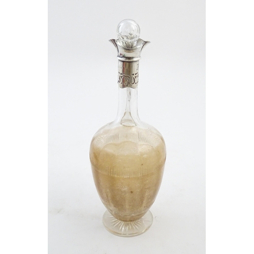 238 - A glass claret jug with silver collar hallmarked Birmingham 1927 maker William Hutton & Sons Ltd. Ap... 