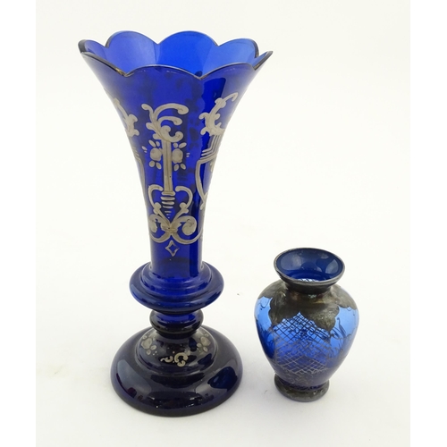 240 - Two items of blue glass, to include an early 20thC blue glass vase with enamel detail, together with... 