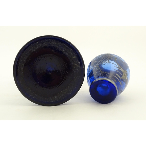 240 - Two items of blue glass, to include an early 20thC blue glass vase with enamel detail, together with... 