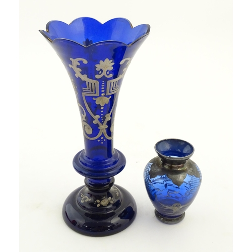 240 - Two items of blue glass, to include an early 20thC blue glass vase with enamel detail, together with... 