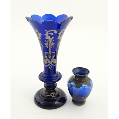 240 - Two items of blue glass, to include an early 20thC blue glass vase with enamel detail, together with... 