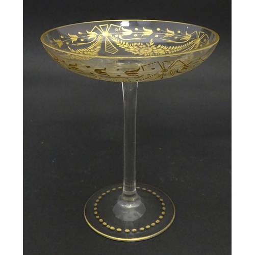 241 - A pedestal glass tazza / sweetmeat dish with etched floral swags and gilt detail.  Approx. 7