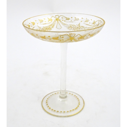 241 - A pedestal glass tazza / sweetmeat dish with etched floral swags and gilt detail.  Approx. 7