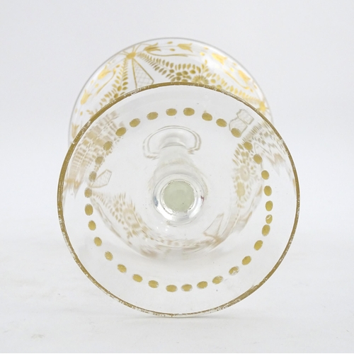 241 - A pedestal glass tazza / sweetmeat dish with etched floral swags and gilt detail.  Approx. 7