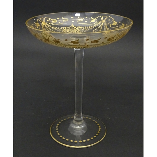 241 - A pedestal glass tazza / sweetmeat dish with etched floral swags and gilt detail.  Approx. 7