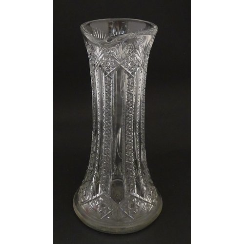 246 - A large cut glass water jug with loop handle. Approx. 12 3/4