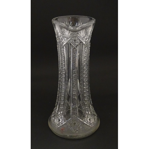 246 - A large cut glass water jug with loop handle. Approx. 12 3/4