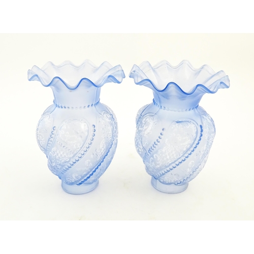 249 - Two moulded blue glass lamp shades with frilled detailing. Approx. 8 3/4