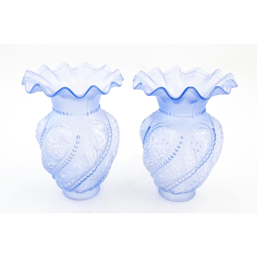 249 - Two moulded blue glass lamp shades with frilled detailing. Approx. 8 3/4