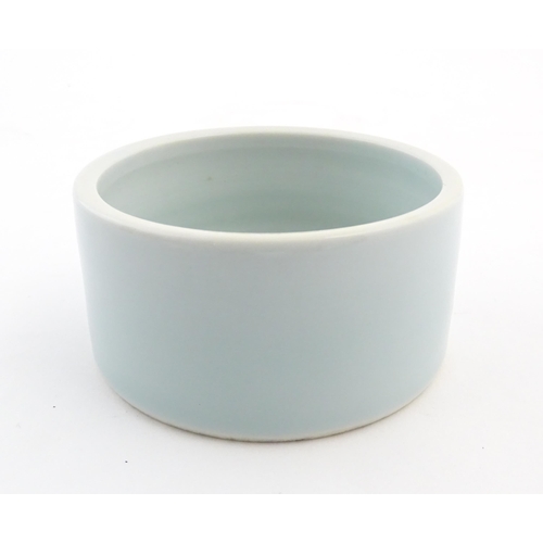 29 - A Chinese brush wash pot of circular form with a pale blue ground. Approx. 1 3/4