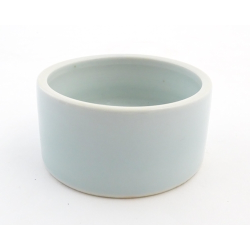 29 - A Chinese brush wash pot of circular form with a pale blue ground. Approx. 1 3/4