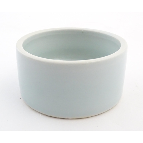 29 - A Chinese brush wash pot of circular form with a pale blue ground. Approx. 1 3/4