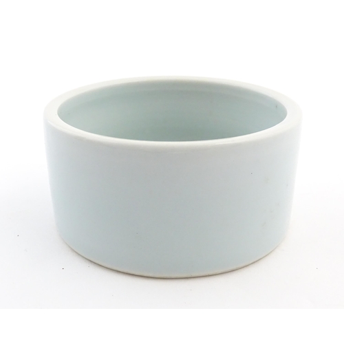 29 - A Chinese brush wash pot of circular form with a pale blue ground. Approx. 1 3/4