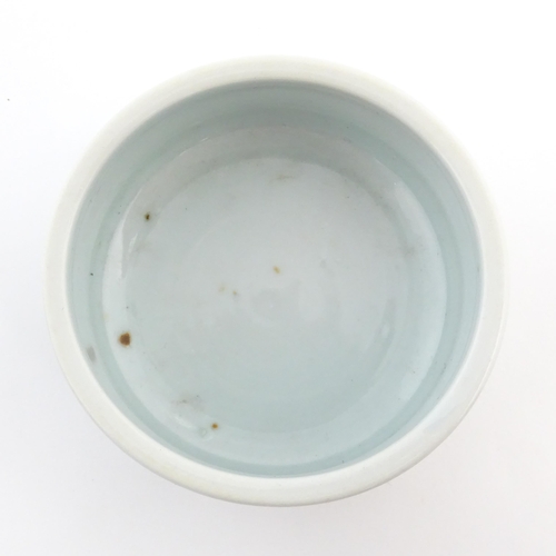 29 - A Chinese brush wash pot of circular form with a pale blue ground. Approx. 1 3/4