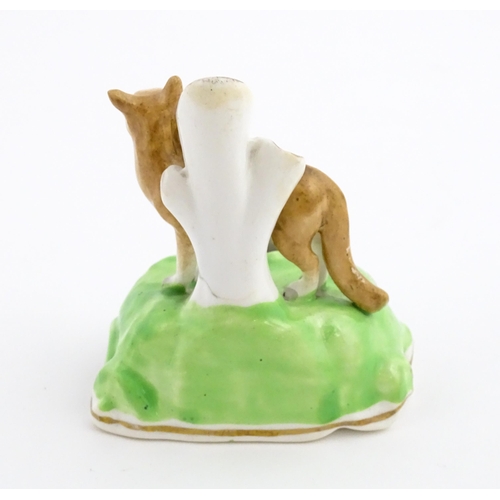 57 - A pen stand / inkwell modelled as a fox with bird. Approx. 3 1/2