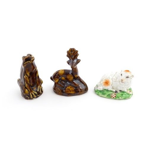 61 - A treacle glazed novelty bird call whistle formed as a frog / toad. Together with a treacle glazed m... 