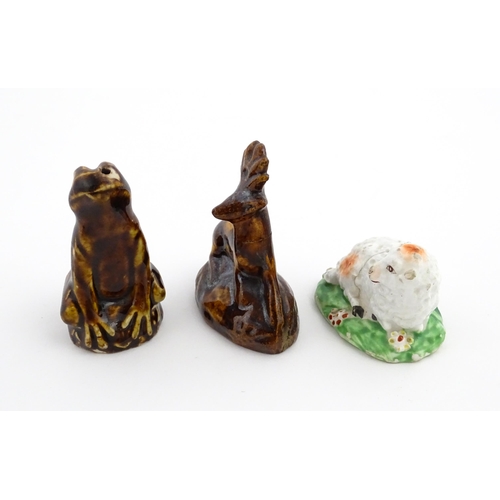 61 - A treacle glazed novelty bird call whistle formed as a frog / toad. Together with a treacle glazed m... 