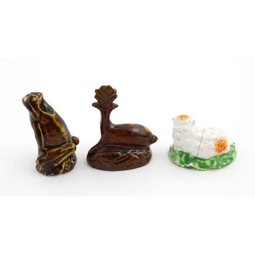 61 - A treacle glazed novelty bird call whistle formed as a frog / toad. Together with a treacle glazed m... 