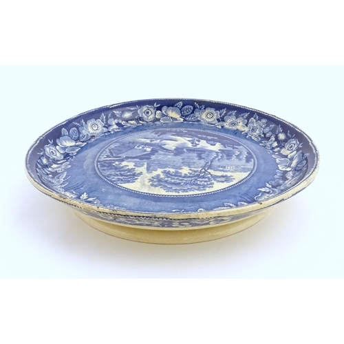 65 - A blue and white footed plate decorated with a view of Nuneham Park, Oxfordshire with wild rose bord... 