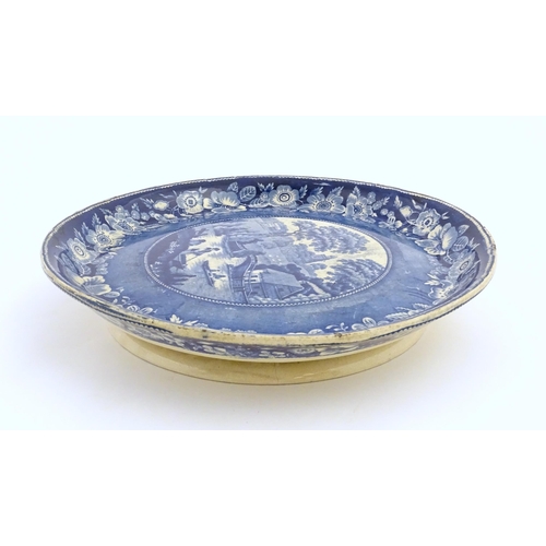 65 - A blue and white footed plate decorated with a view of Nuneham Park, Oxfordshire with wild rose bord... 