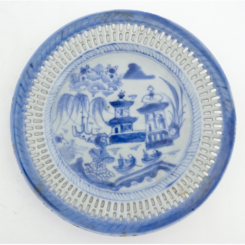 66 - A Spode blue and white ribbon plate decorated in the Tower plate. Together with a Chinese blue and w... 