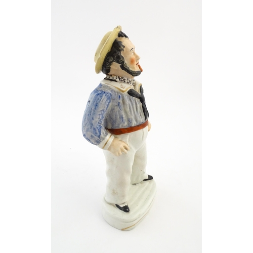 68 - A Staffordshire pottery model of a sailor smoking a pipe. Approx. 13