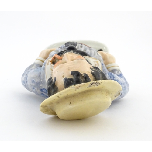 68 - A Staffordshire pottery model of a sailor smoking a pipe. Approx. 13