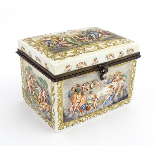 72 - A Capodimonte porcelain casket / box decorated in relief with Bacchanalian scenes, to include huntin... 